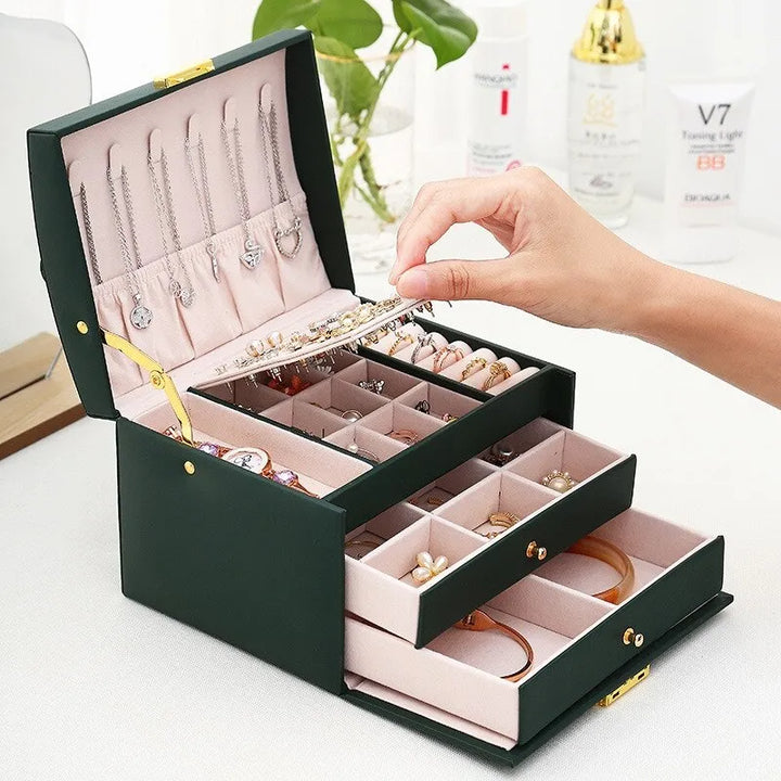 Velvet lined 3-tier jewelry organizer in luxurious faux leather, ideal for women's accessory storage.