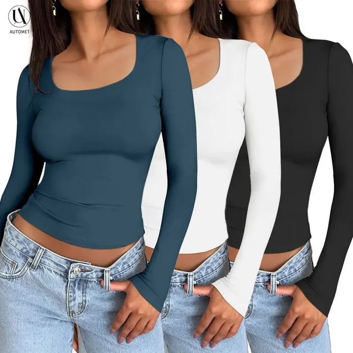 Close-up of a black women's ribbed long sleeve scoop neck top, showcasing the knit texture and thumbhole detail.