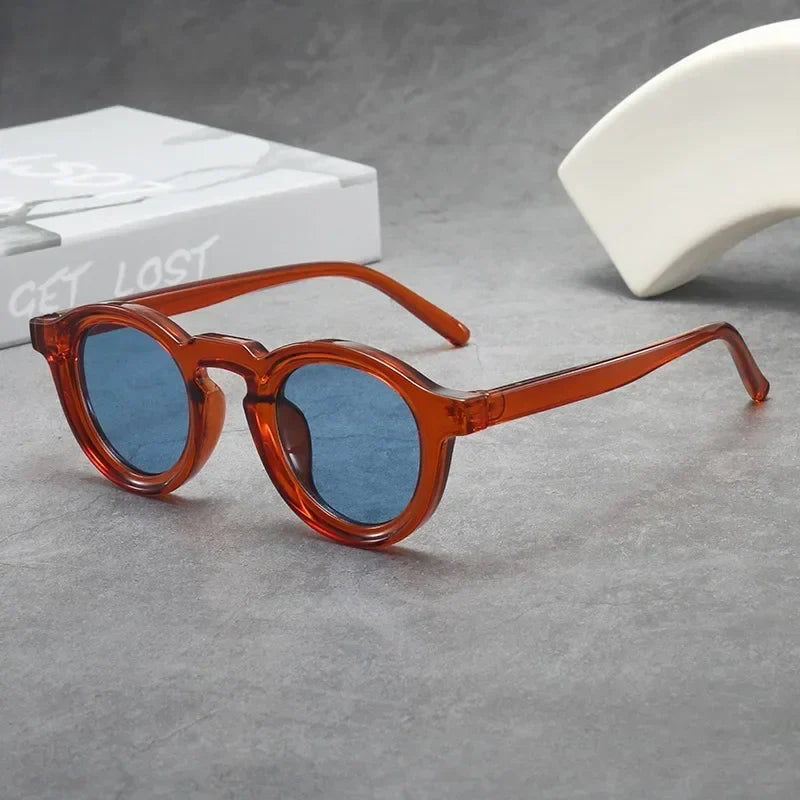 Trendy round tinted sunglasses; essential unisex eyewear for style, comfort & everyday protection.
