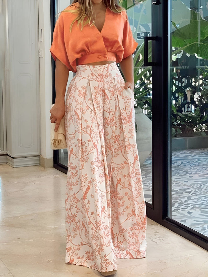 Elegant women's two-piece summer set with comfortable wide-leg pants and a stylish three-quarter sleeve blouse.