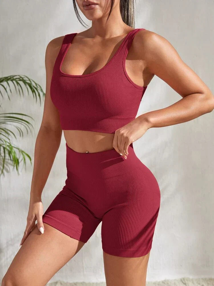 Sienna two-piece women's workout set with high-waist athletic shorts and a matching sports crop top.