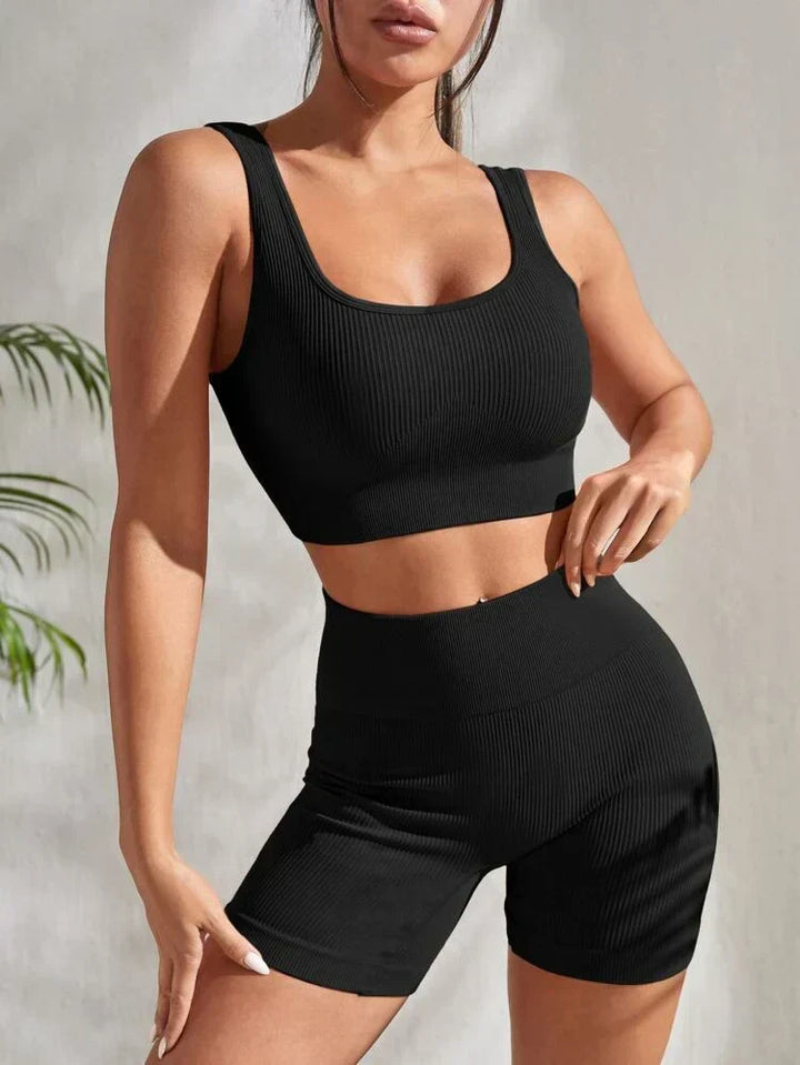 Dynamic women's active style set: high-waist fitness shorts & supportive sports top for various activities.