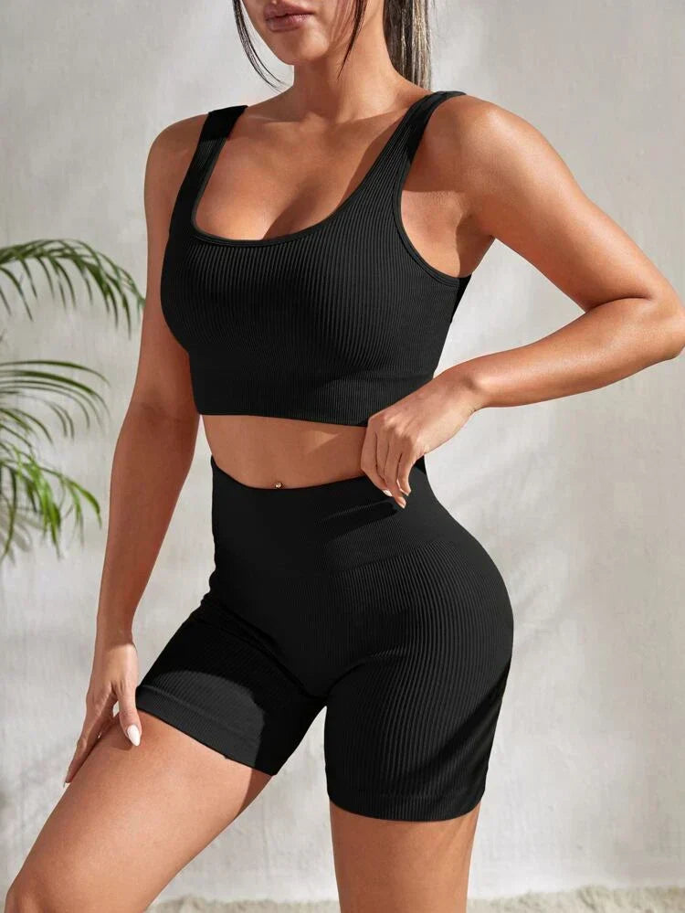 Women's two-piece activewear set: athletic high-waist shorts and a comfortable sports top for exercise.