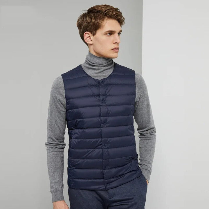 Men's sleeveless down vest, a comfortable and ultralight outerwear piece for everyday wear.
