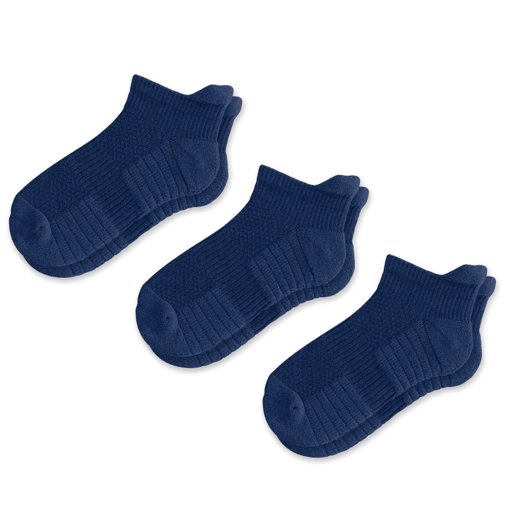 Stack of multiple pairs of unisex ankle compression socks, ready for retail display