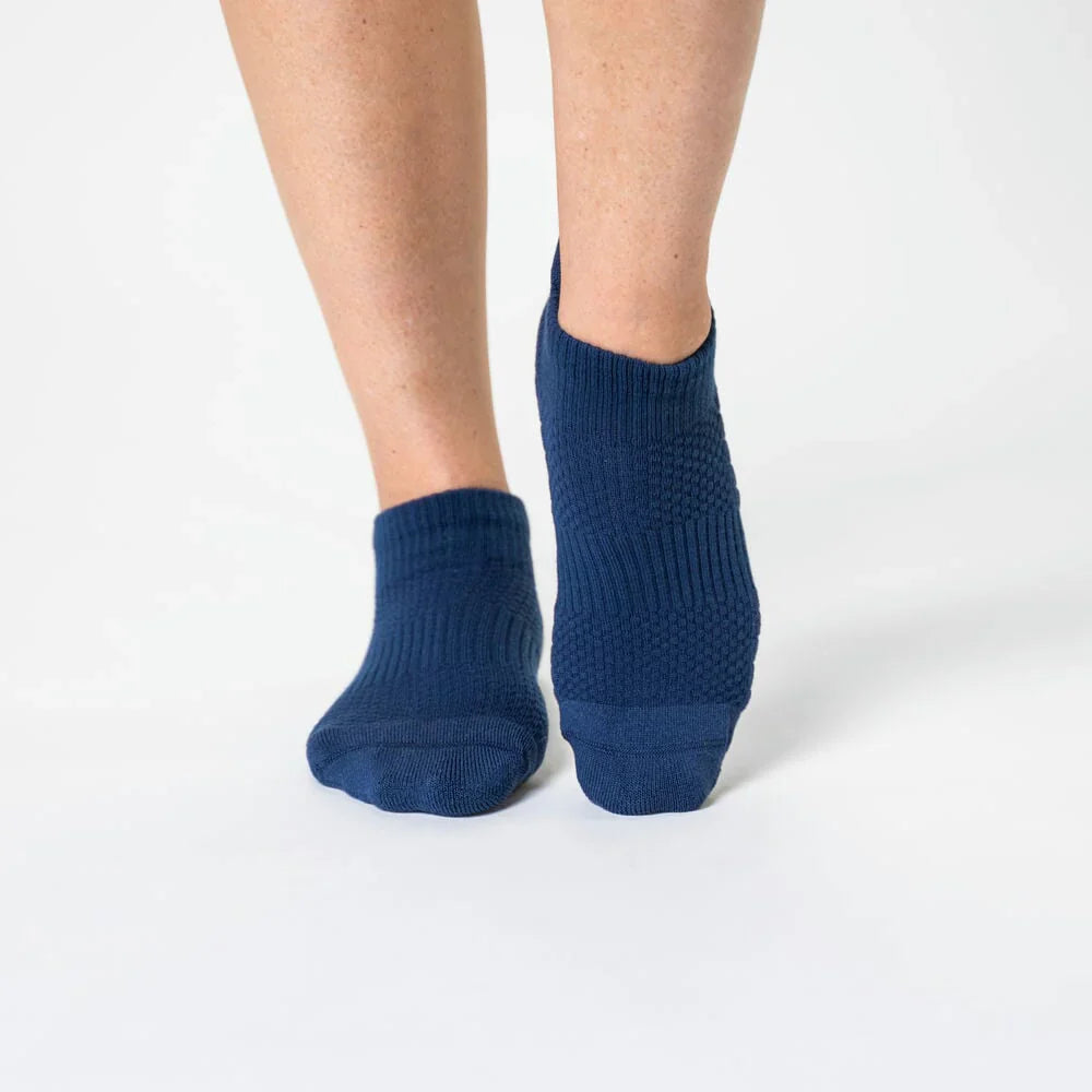 Pair of white unisex ankle compression socks providing foot care and pressure relief