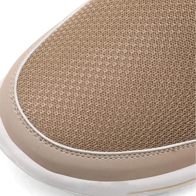 Breathable knit fabric detail on the upper of a slip-on backless athletic sneaker slide.