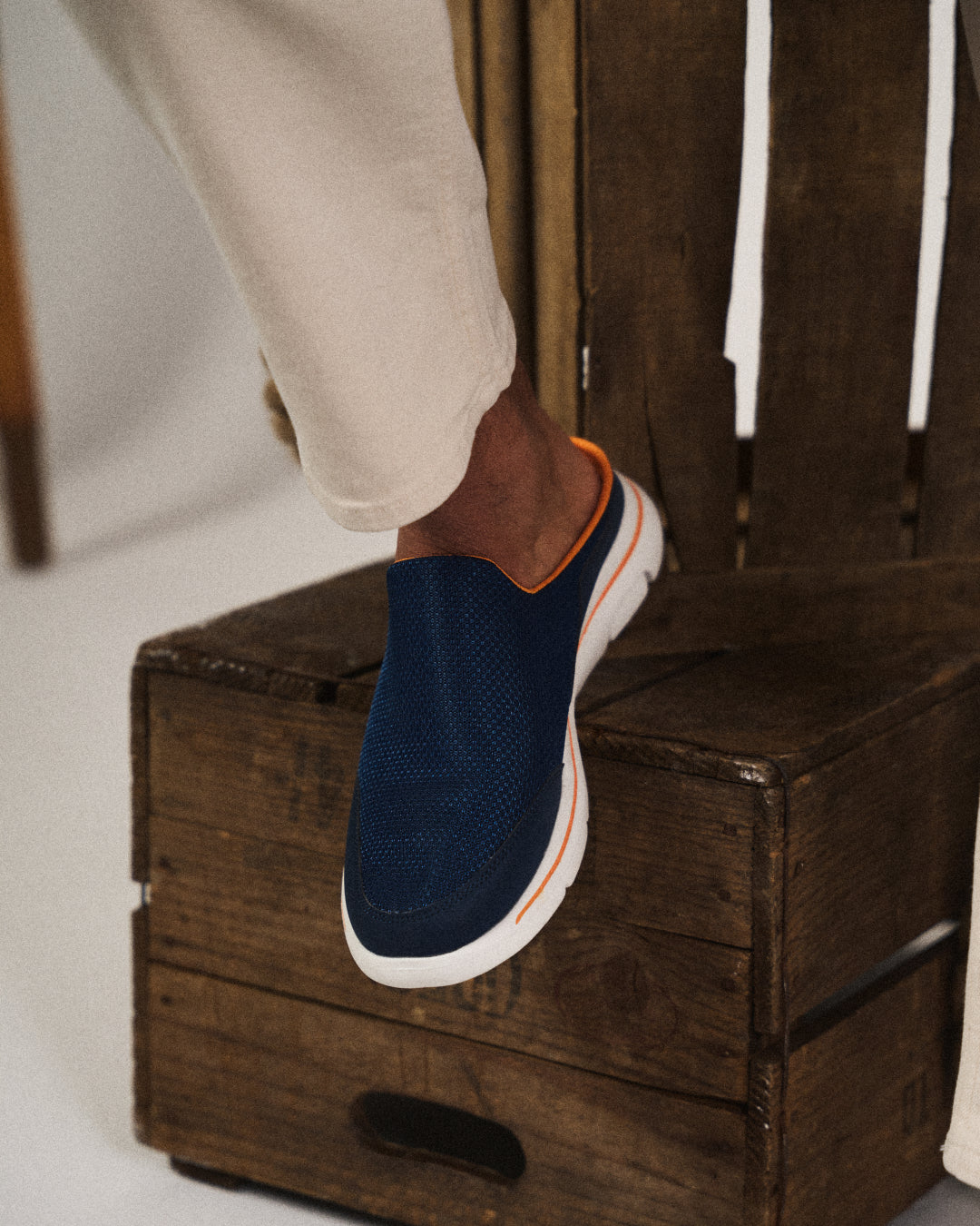 Side profile of a backless sneaker slide, highlighting the cushioned sole for ultimate comfort.