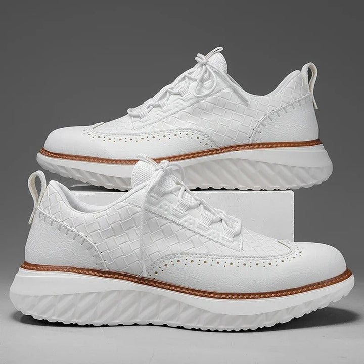 White unisex running shoes, offering support and breathability for active lifestyles.
