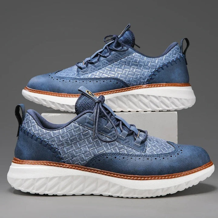 Close-up of the breathable upper on a white unisex comfort sneaker, daily wear.