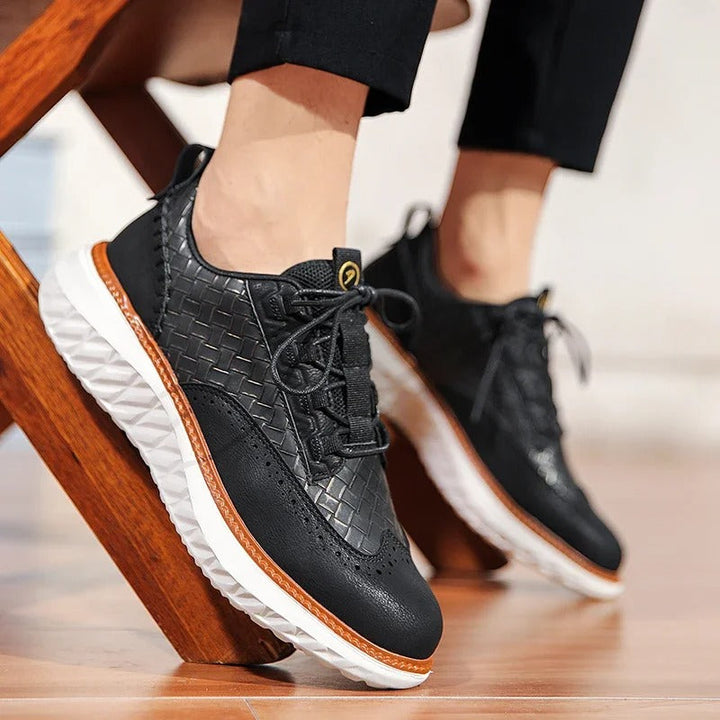Side view of a white unisex athletic shoe, highlighting cushioned sole for comfort.