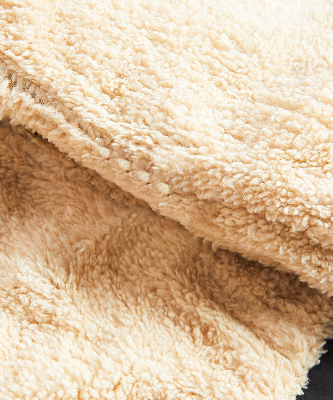 Close-up of the vest's zipper and high collar, offering extra warmth
