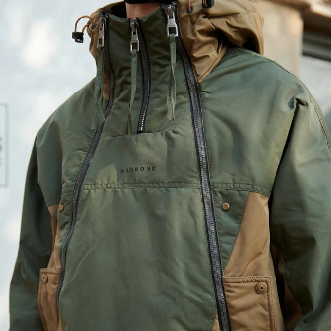 Detail of the zipper and adjustable cuffs on a unisex insulated winter techwear jacket