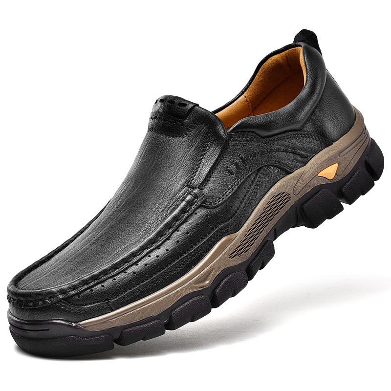 Detail of the slip-resistant sole and stitching on a brown unisex orthopedic arch support transition boot for safety