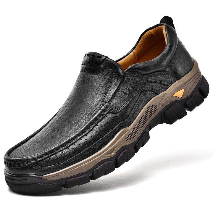 Detail of the slip-resistant sole and stitching on a brown unisex orthopedic arch support transition boot for safety