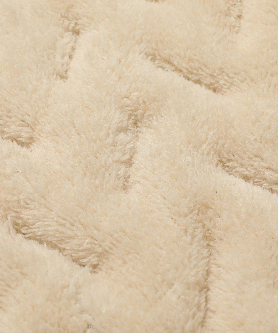 Close-up of the quilted pattern on a unisex puffer vest, providing warmth and a stylish outerwear look