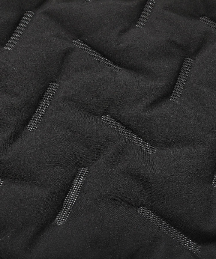 Front view of an empty unisex gray quilted puffer vest, highlighting its lightweight yet warm design