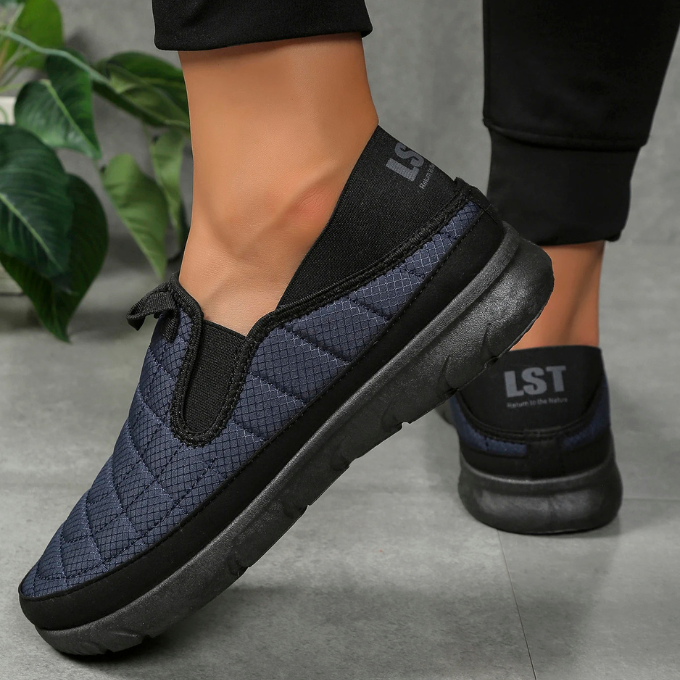 Close-up of the sole of a slip-on comfort casual shoe, showing traction and durability for walkers