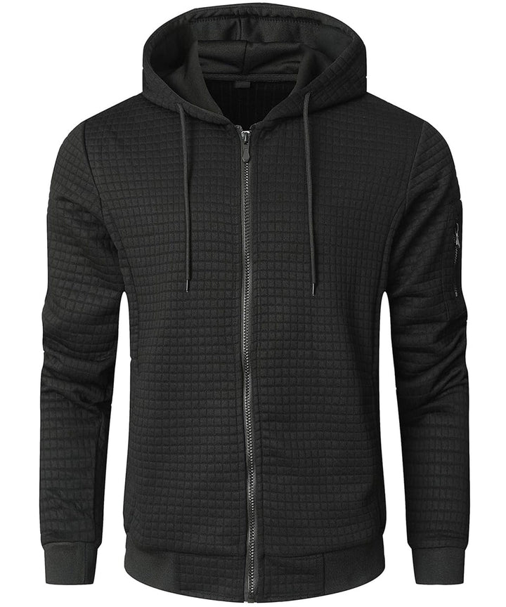 Model wearing a black unisex thermal adventure hoodie, ideal for casual and active wear