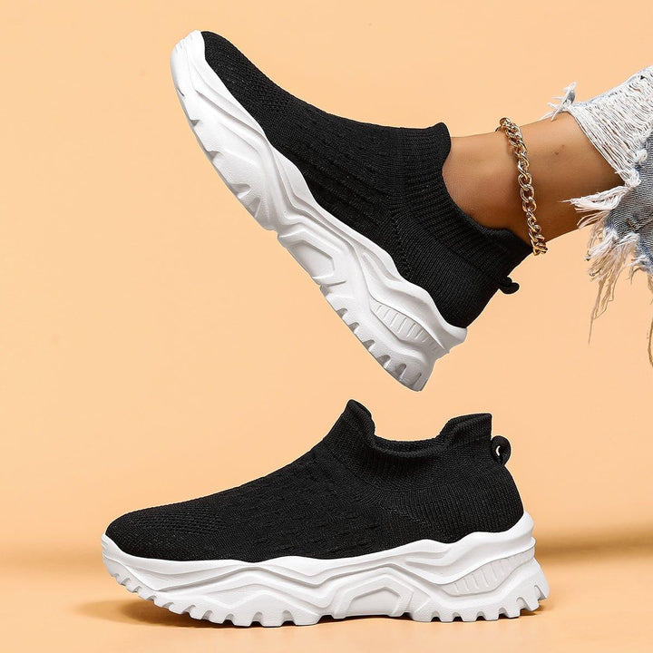 Stylish black & white orthopedic slip-on shoes for men and women, great for casual wear