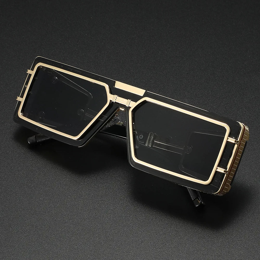 A pair of unisex geometric aviator sunglasses with a bold frame, golden details, and UV400 protection.