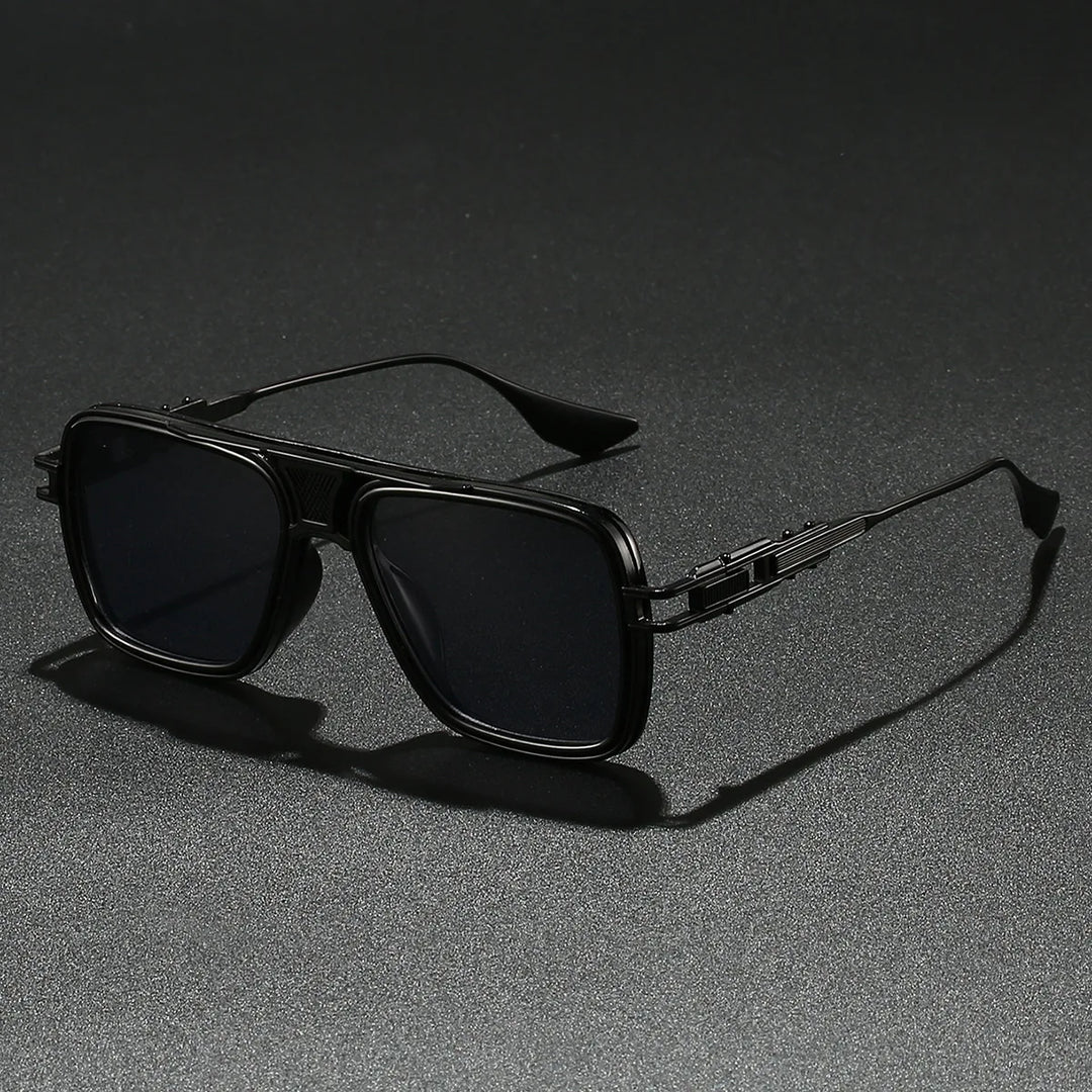 Pair of Bold Gold Frame UV400 Sunglasses resting on a reflective surface, trendy eyewear