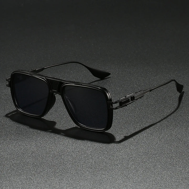 Pair of Bold Gold Frame UV400 Sunglasses resting on a reflective surface, trendy eyewear