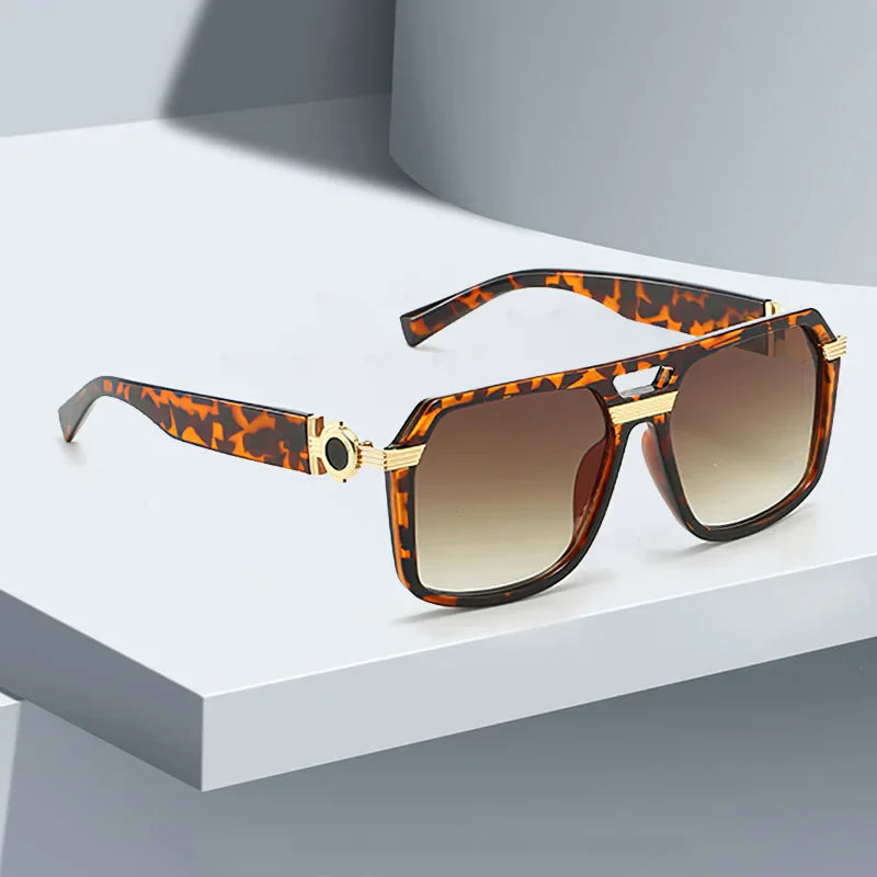 Fashionable square frame unisex sunglasses featuring a bold design and effective UV400 eye protection.
