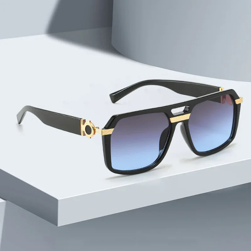 Bold square frame sunglasses for men and women, equipped with UV400 gradient lenses for optical clarity.