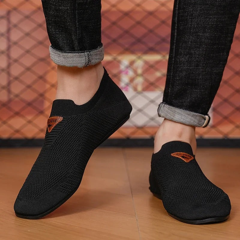 Side profile of a lightweight unisex slip-on sneaker, ideal for casual walking.