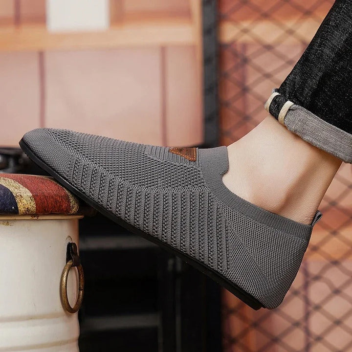 Sole of a lightweight unisex comfort shoe, showing good grip for walking.