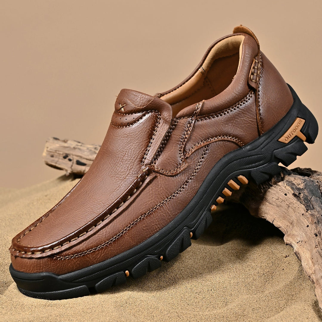Side profile of a brown orthopedic comfort leather boot for men, transition style, ankle support