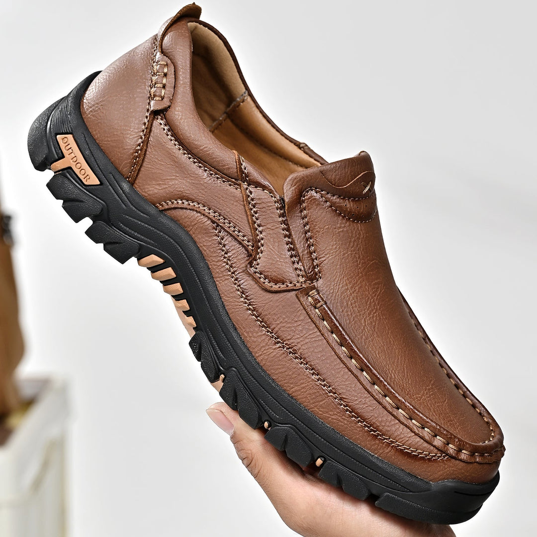 Close-up of the textured leather on a unisex comfort orthopedic boot, brown color, durable