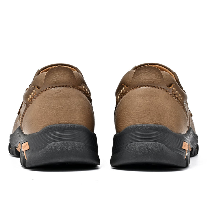 Close-up showing the supple brown leather of an orthopedic comfort transition boot, natural grain