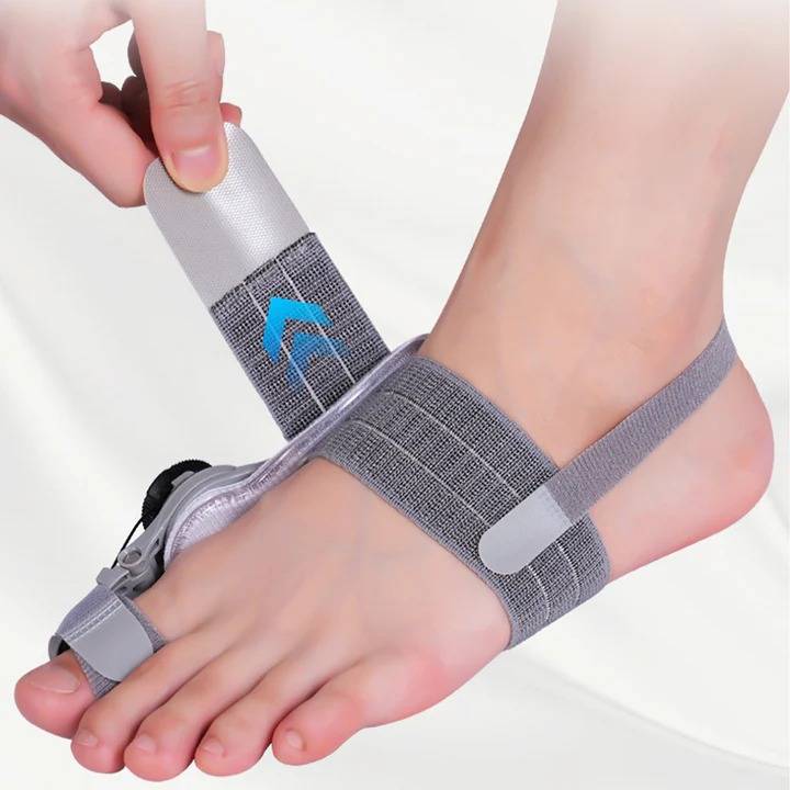 Unisex bunion corrector with toe spacer in beige silicone, featuring adjustable heel strap for foot pain relief and alignment