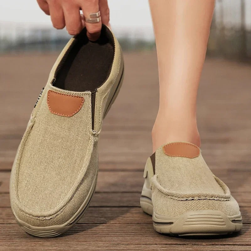 Durable rubber sole on unisex casual canvas slip-on shoes, built for walking.