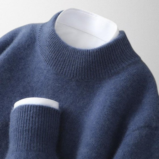 Close-up of a luxurious cashmere knit sweater, highlighting the soft fibers of this unisex pullover.