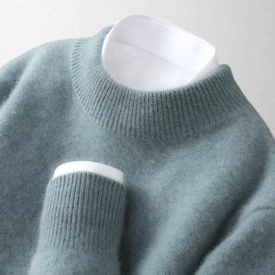 Unisex winter cashmere sweater, a comfortable and classic crew neck pullover in a neutral tone.