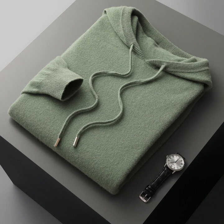 Unisex Classic Comfort Pullover Hoodie, on a hanger, showcasing drape of fabric