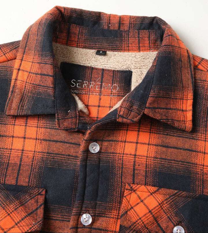 Back view of a comfortable unisex flannel shirt jacket, showcasing plaid pattern.