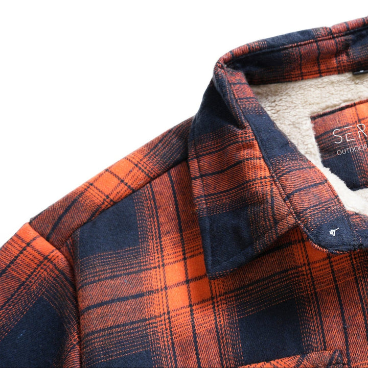 Close-up of the soft-touch fabric on a unisex classic plaid flannel shirt jacket.