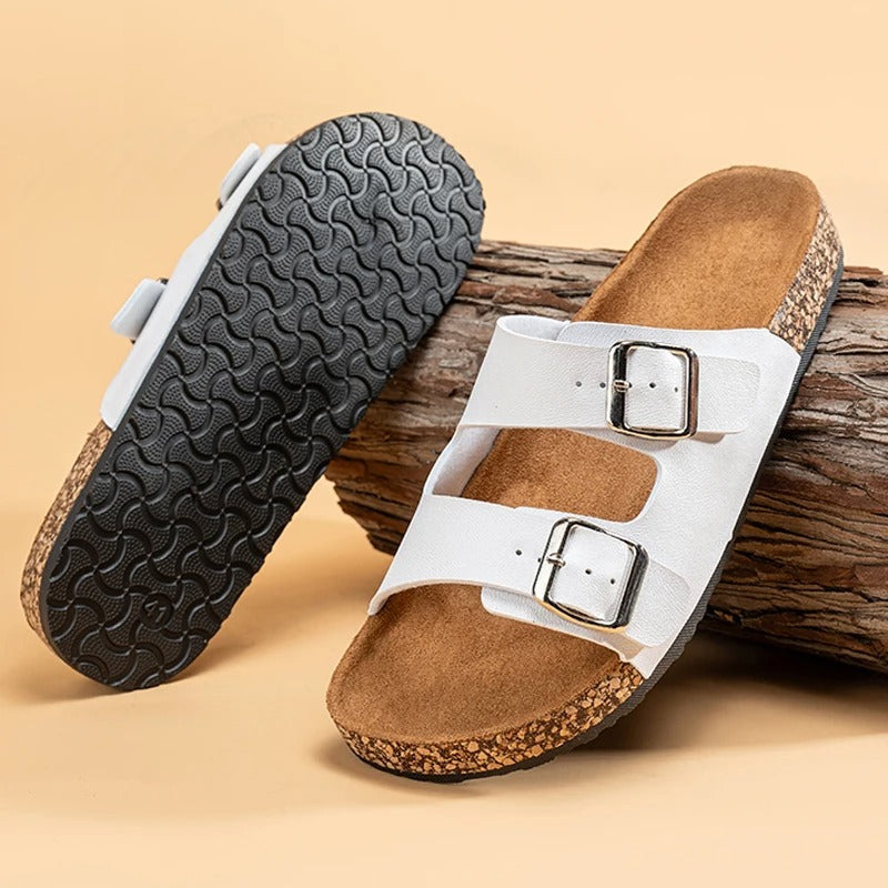 Unisex Double Buckle Slide Sandals on a beach, representing ideal casual summer footwear.