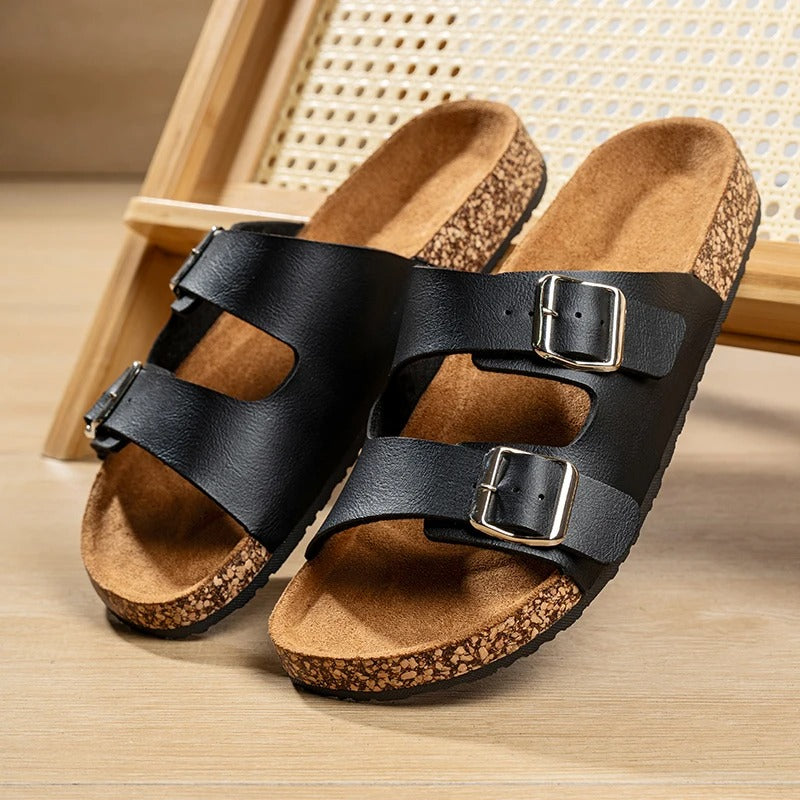 Pair of Unisex Comfort Double Buckle Slide Sandals, showcasing two adjustable straps and a cork footbed.