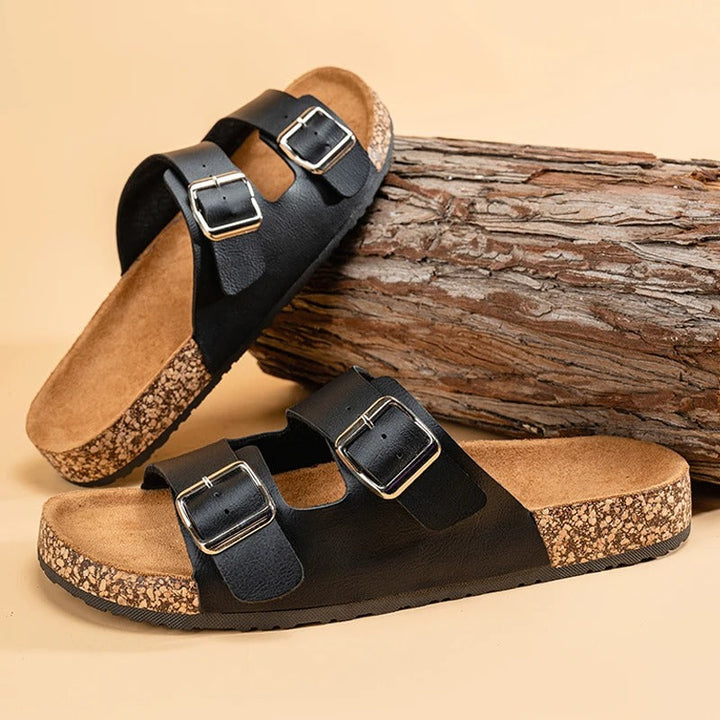 Side view of Unisex Comfort Slide Sandals, showing the contoured cork footbed and durable outsole.