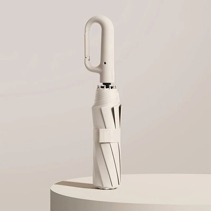 "Unisex compact umbrella with UV protection, featuring a reinforced frame, sleek design, and ergonomic handle in various colo