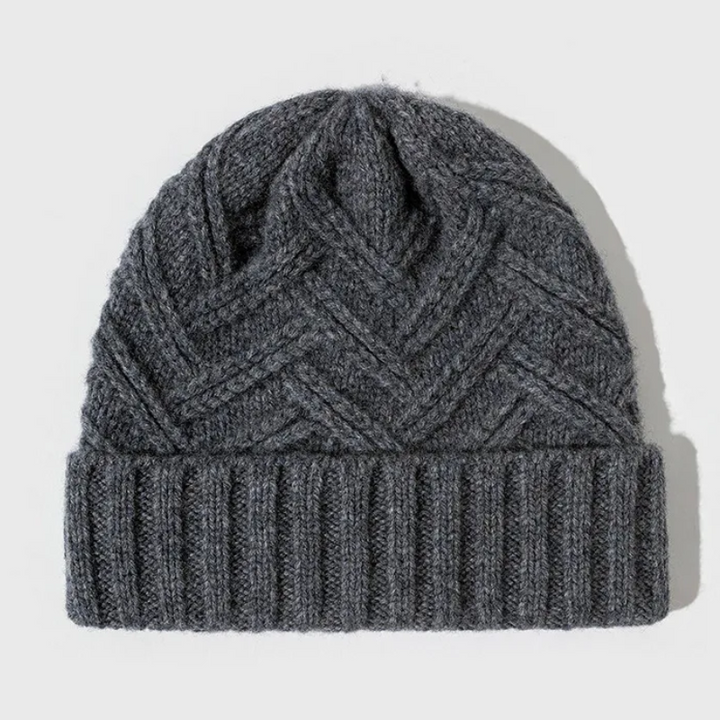 Soft knit beanie featuring a prominent chevron pattern, designed for unisex winter comfort