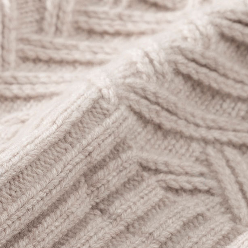 Stylish unisex knit beanie with a unique chevron design, perfect for winter fashion and warmth
