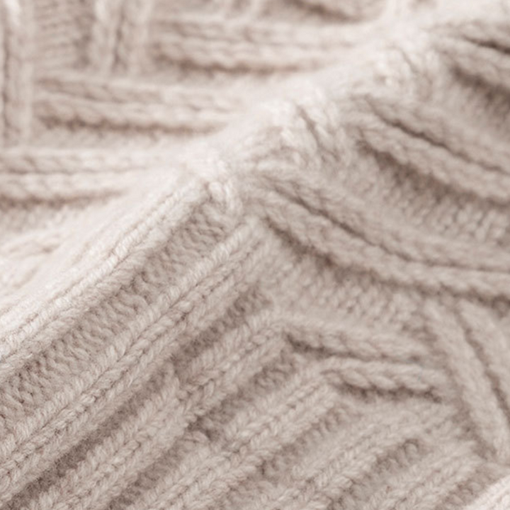 Stylish unisex knit beanie with a unique chevron design, perfect for winter fashion and warmth