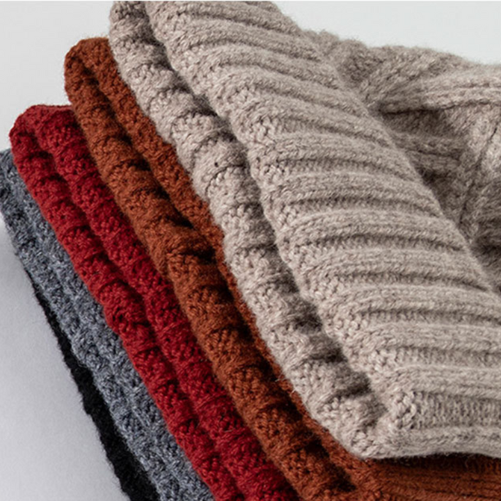Unisex winter beanie showcasing its ribbed cuff and detailed chevron knit pattern, ready for snow