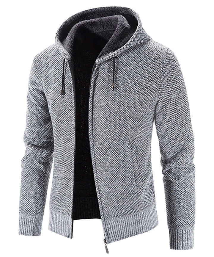 A person relaxing in a soft, cozy fleece zip-up hoodie, illustrating its comfort